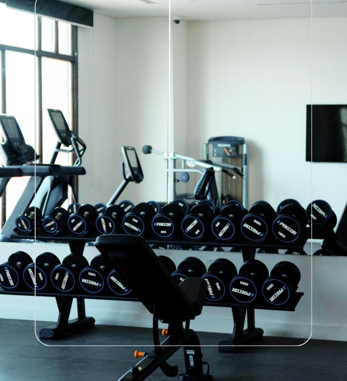 Mina Hotel And Residences By The Torch Доха Екстериор снимка A set of dumbbells