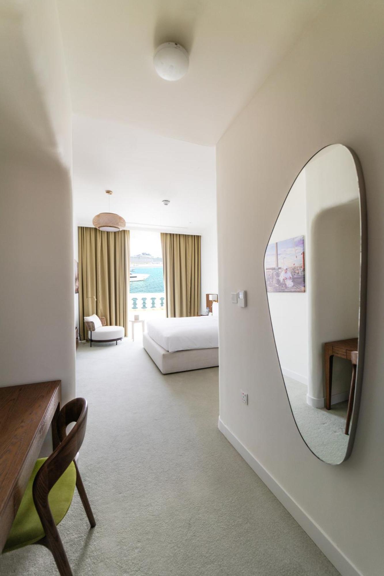 Mina Hotel And Residences By The Torch Доха Екстериор снимка A bedroom at the hotel
